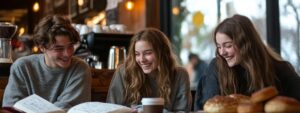 Group of students laughing and studying biochemistry together at a café.